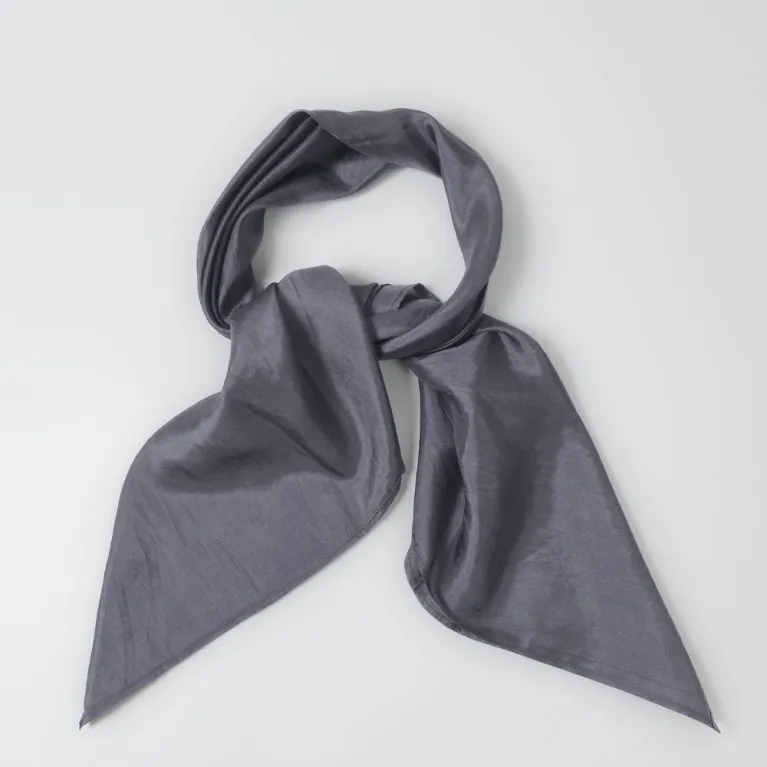 This Grey Silk Square Scarf, a traditionally woven and handcrafted Vietnamese accessory made from natural silk, offers a subtle yet luxurious look, making it a thoughtful gift for her