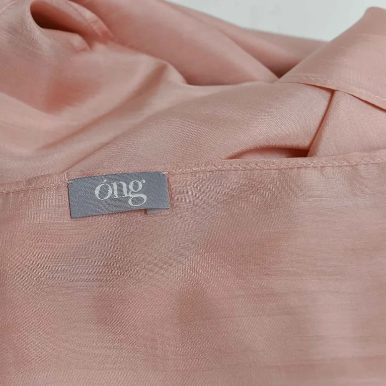 The Rose Pink Silk Scarf, handcrafted from natural silk, beautifully enhances her youthful glow, making it a timeless feminine accessory that blends tradition with elegance - an exquisite Vietnamese gift perfect for her