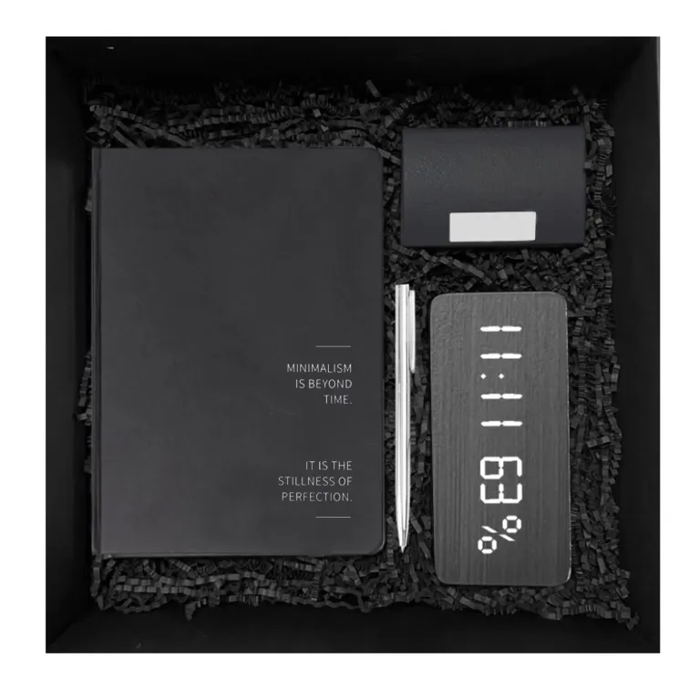 The "Black Master" Gift Box proves that simple things create a gentleman's aura, featuring a sleek black gift set with a notebook and pen, clock, and card holder—a refined gift for her.