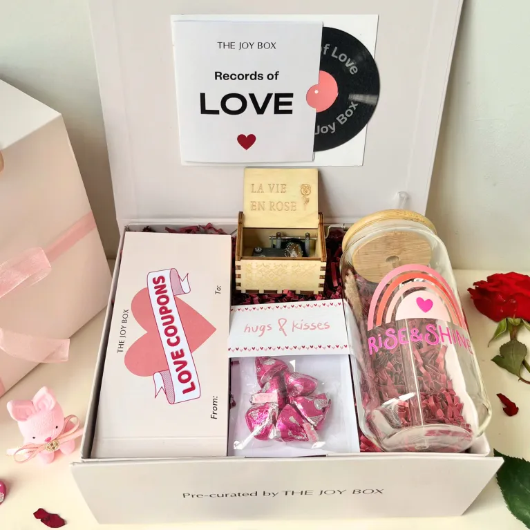 The "Actually" Valentine Gift Box creates a romantic love melody, featuring a charming music box, elegant glass, and decadent chocolate - the perfect Valentine's Day gift for her to cherish and celebrate love