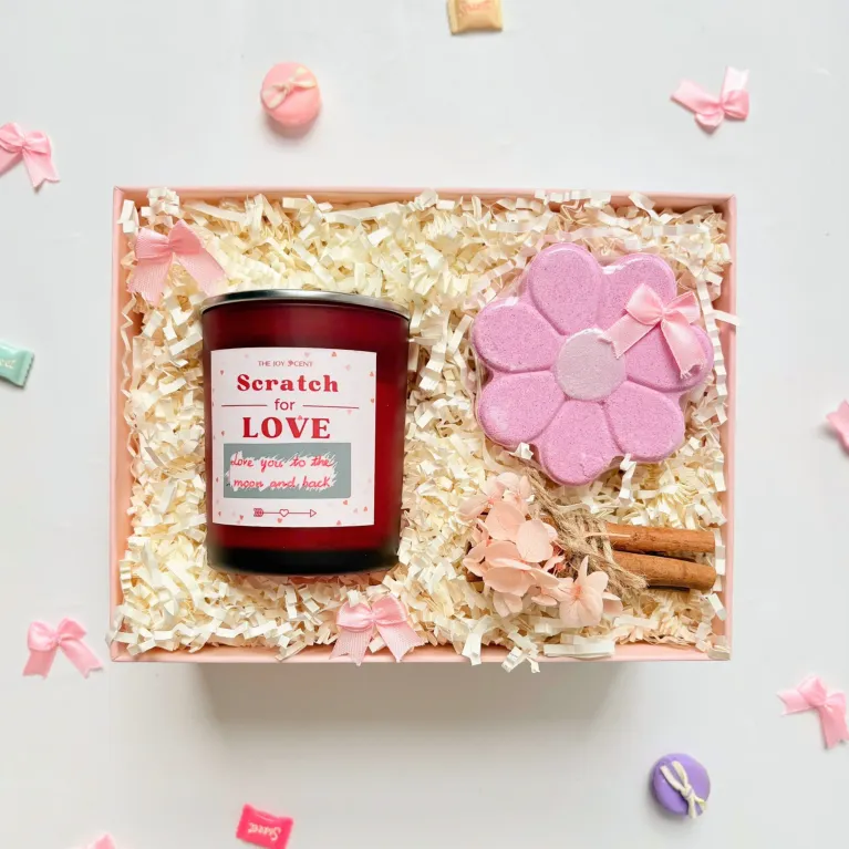 The "Warm Hugs" Valentine Gift Box is a heartfelt way to express sweet whispers of love, featuring a hidden message scented candle and a luxurious bath bomb, creating a cozy and romantic personalized Valentine's gift box for your special someone