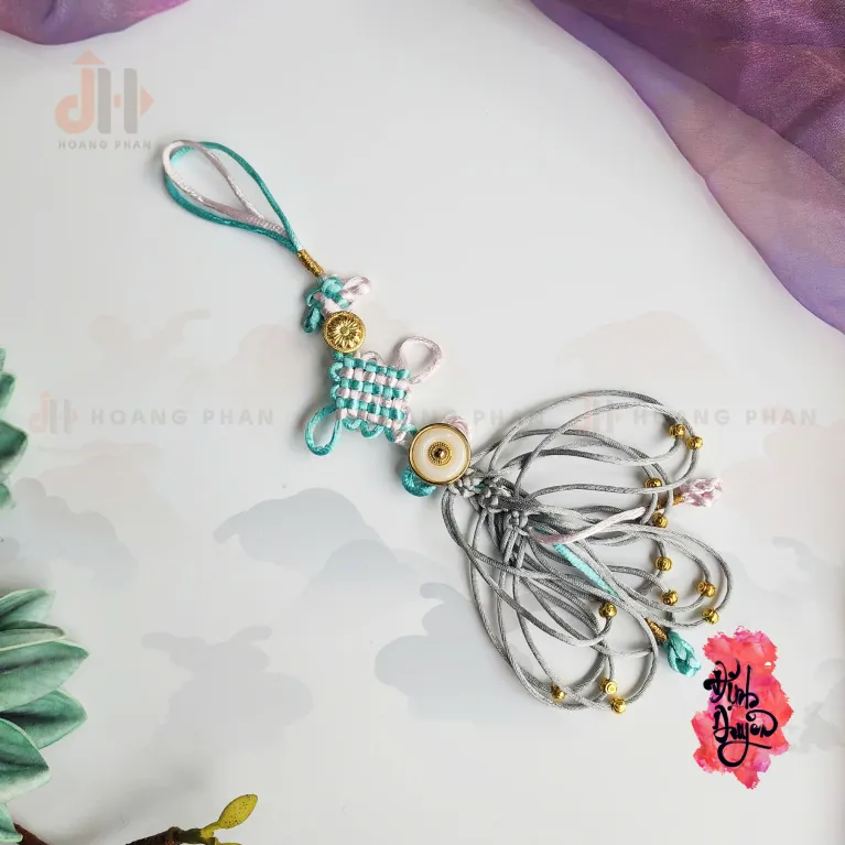 The "Light Teal" Heart-Knot Bond Cord is a delicate feng shui accessory that softly invites auspicious energy, making it a perfect Vietnamese gift for Women's Day or a heartfelt engagement gift for her.