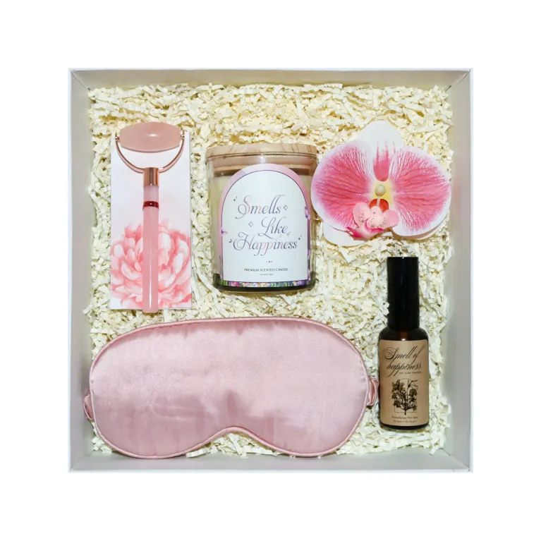 The Scent of Serenity Gift Set is the perfect way to enjoy a relaxing moment, featuring a scented candle, scent spray, eye mask, and massage roller—an elegant Women's Day gift box designed to pamper and rejuvenate, making it the ultimate gift for her
