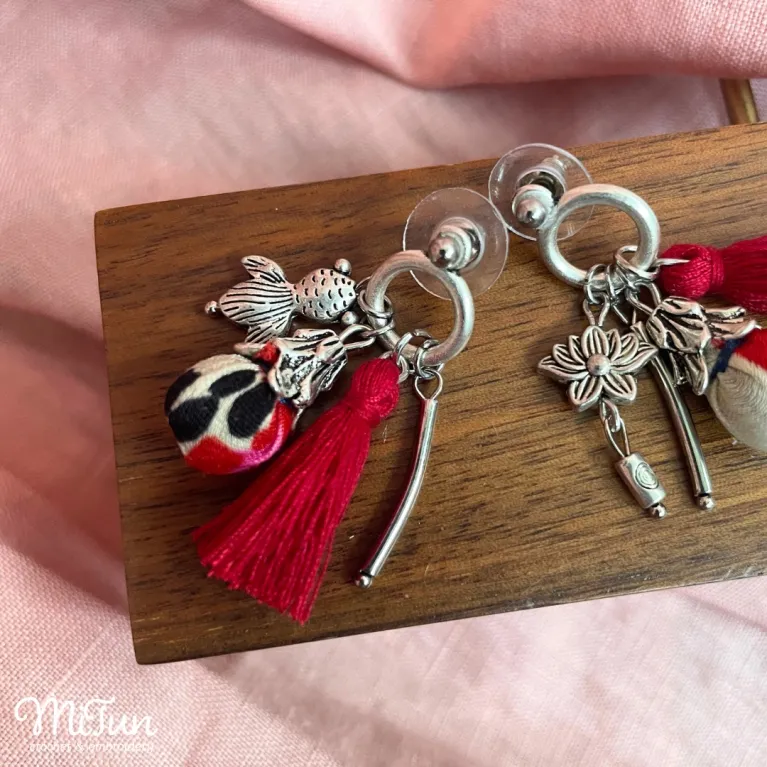Elevate her style with Silk Tassel Earrings, a mesmerizing fusion of Eastern beauty and artisanal charm - these handmade accessories, adorned with delicate charms, make for a unique jewelry piece and a perfect birthday or special occasion gift for her.