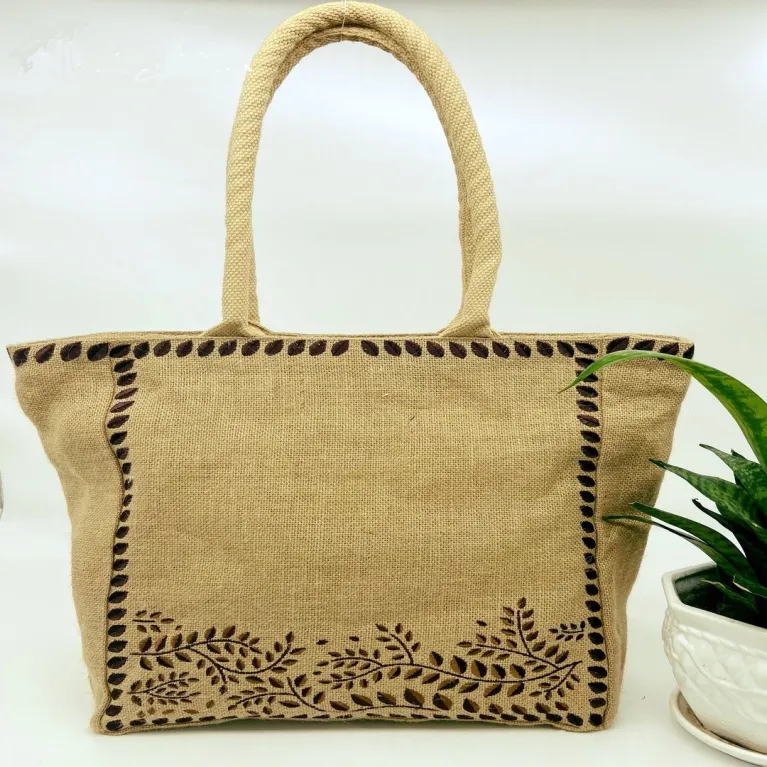 The Embroidered Leaf Jute Tote Bag captivates with its gentle vintage style, making it an elegant handmade eco-bagv - a perfect gift for mom or a Women’s Day gift for her
