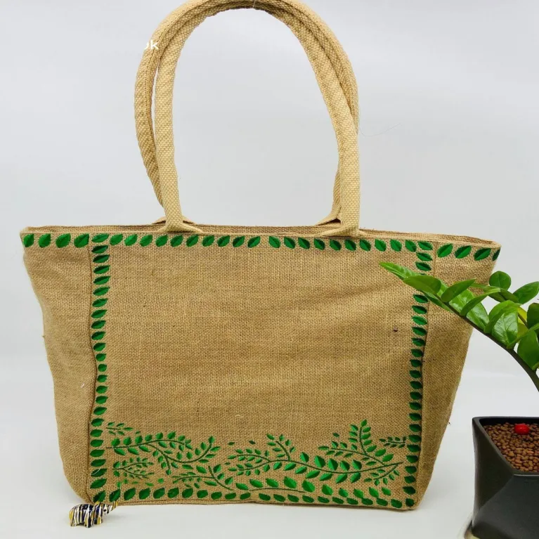 The Embroidered Leaf Jute Tote Bag captivates with its gentle vintage style, making it an elegant handmade eco-bagv - a perfect gift for mom or a Women’s Day gift for her