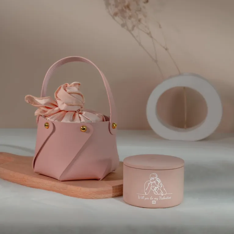 The Scented Candle in Leather Holder & Silk Scarf Gift Set is a thoughtful gift wrapped in love, featuring a scented candle with a hidden message in a personalized jar—a perfect gift for her on any special occasion.