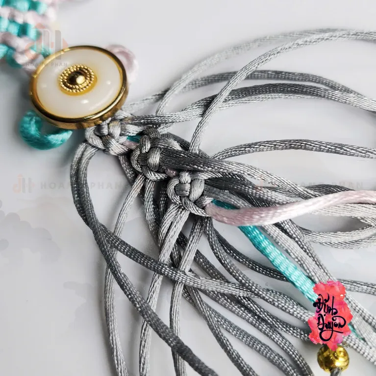 The "Light Teal" Heart-Knot Bond Cord is a delicate feng shui accessory that softly invites auspicious energy, making it a perfect Vietnamese gift for Women's Day or a heartfelt engagement gift for her.