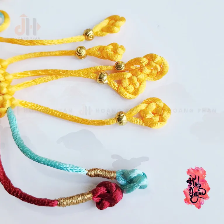 The "Nhu Y" Knot Moon Hanging Decoration is a beautiful traditional ornament that serves as a positive energy source, making it a perfect Feng Shui gift and decorative accessory for any space - an elegant and meaningful gift for her.
