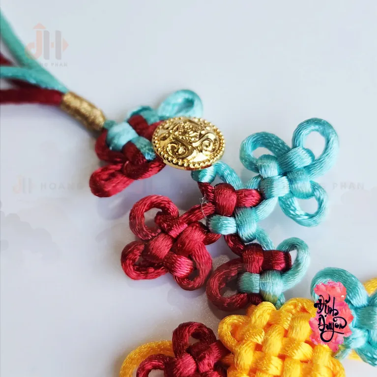The "Nhu Y" Knot Moon Hanging Decoration is a beautiful traditional ornament that serves as a positive energy source, making it a perfect Feng Shui gift and decorative accessory for any space - an elegant and meaningful gift for her.