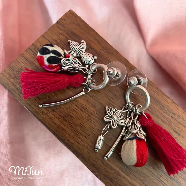 Elevate her style with Silk Tassel Earrings, a mesmerizing fusion of Eastern beauty and artisanal charm - these handmade accessories, adorned with delicate charms, make for a unique jewelry piece and a perfect birthday or special occasion gift for her.