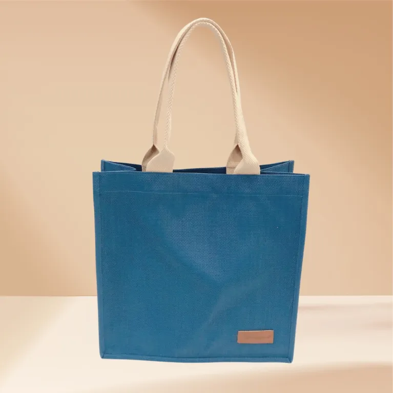 The Textile Shopping Bag (26 x 32cm) in Elegant Blue is a stylish and practical fabric gift bag, perfect as an office lunch bag or textile fabric working bag, crafted from high-quality material - a refined handmade gift for any occasion.