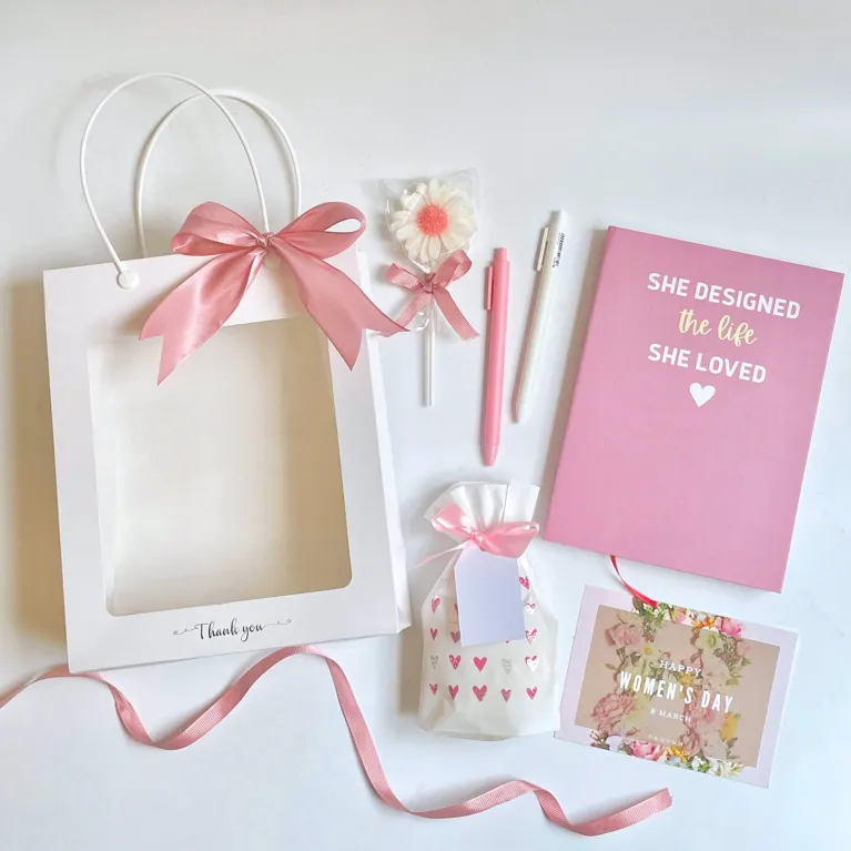 The "Flower Candle" Gift Set is a charming blind bag gift box with scented wax, a notebook, and a ballpoint pen, making it an adorable Women's Day gift for your girlfriend or any cute gift to cherish special moments