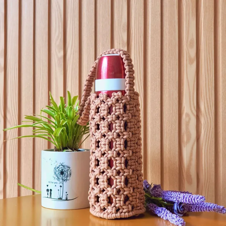 The Macrame Bottle Bag is an exquisite handmade tumbler bag, adding style & convenience to every day - a unique birthday gift for craft lovers.