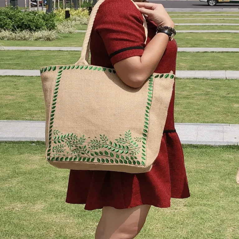 The Embroidered Leaf Jute Tote Bag captivates with its gentle vintage style, making it an elegant The Embroidered Leaf Jute Tote Bag captivates with its gentle vintage style, making it an elegant handmade eco-bagv - a perfect gift for mom or a Women’s Day gift for herhandmade eco-bagv - a perfect gift for mom or a Women’s Day gift for her