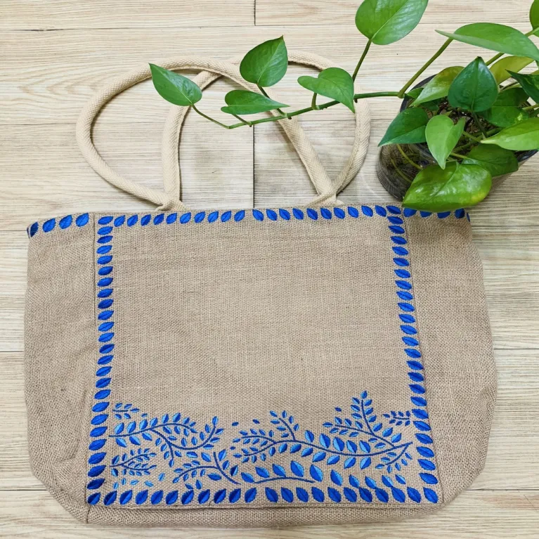 The Embroidered Leaf Jute Tote Bag captivates with its gentle vintage style, making it an elegant handmade eco-bagv - a perfect gift for mom or a Women’s Day gift for her