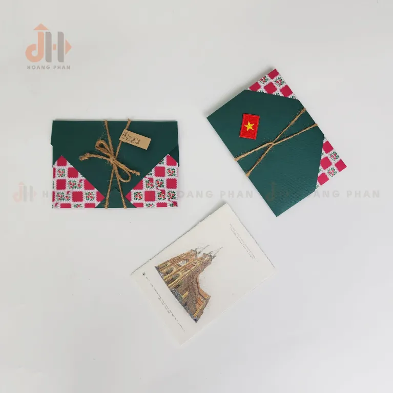 The Notre Dame Cathedral Postcard from the I Love Saigon Collection beautifully captures the city's landmarks in a handmade, layered paper design, making it a unique souvenir complete with an elegant envelope
