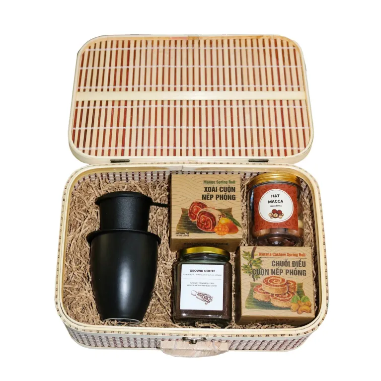 Discover the "Vietnam Flavor Treasure" Gift Set, a premium taste of Vietnam with specialty treats, a ceramic mug, and a traditional coffee filter
