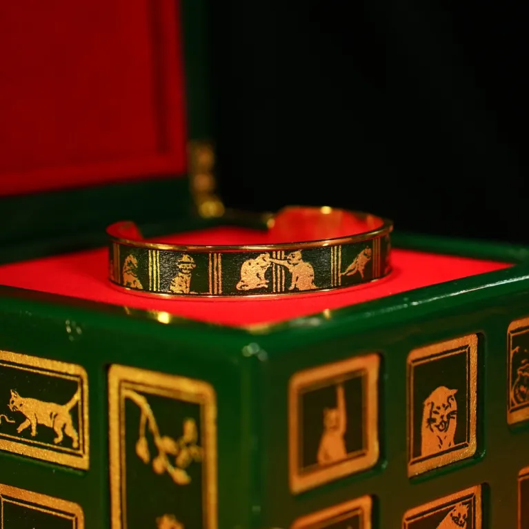 The "Cat & Box" Metal Cuff Bracelet With Hand-Painted Leather is a handmade fashion accessory that beautifully highlights individuality, making it a perfect birthday gift for her.