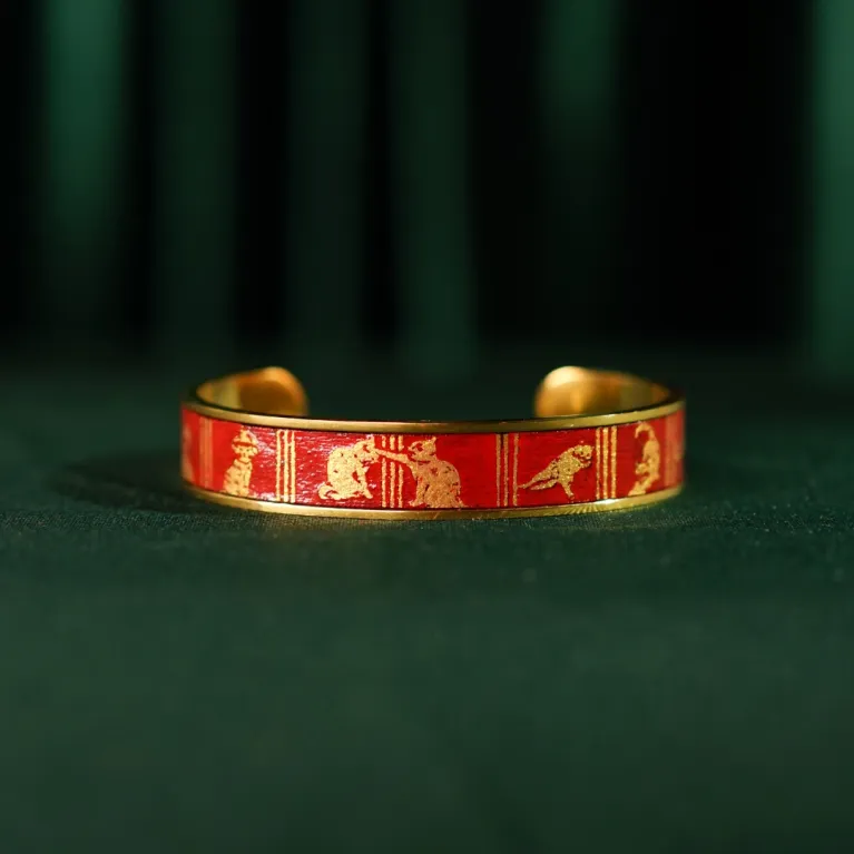 The "Cat & Box" Metal Cuff Bracelet With Hand-Painted Leather is a handmade fashion accessory that beautifully highlights individuality, making it a perfect birthday gift for her.