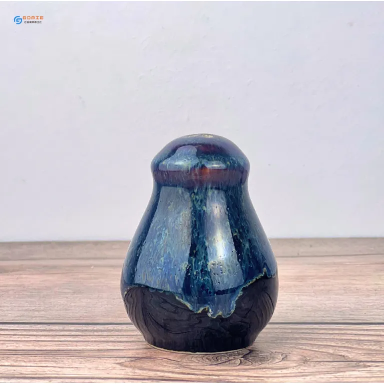 The Fire-Glazed Ceramic Spice Jar brings elegance from kitchen to dining table, crafted from premium Bat Trang ceramic, making it a perfect addition to luxury restaurant accessories and authentic Vietnamese kitchenware.