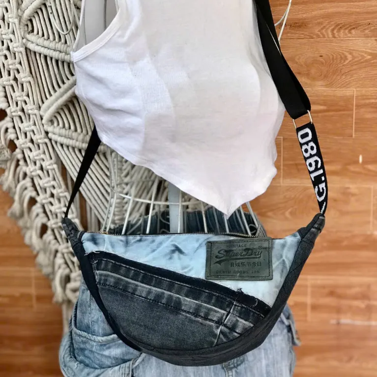 Contrast crossbody bag from old jeans where uniqueness and eco-friendliness take the throne, creating an upcycled accessory and unique birthday gift for sustainable fashion lovers.