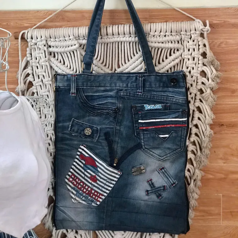 "7Color" slim tote bag from old jeans honors creative souls through unique denim craftsmanship, offering a fashionable accessory that makes an impressive and meaningful handmade birthday gift."7Color" slim tote bag from old jeans honors creative souls through unique denim craftsmanship, offering a fashionable accessory that makes an impressive and meaningful handmade birthday gift."7Color" slim tote bag from old jeans honors creative souls through unique denim craftsmanship, offering a fashionable accessory that makes an impressive and meaningful handmade birthday gift.
