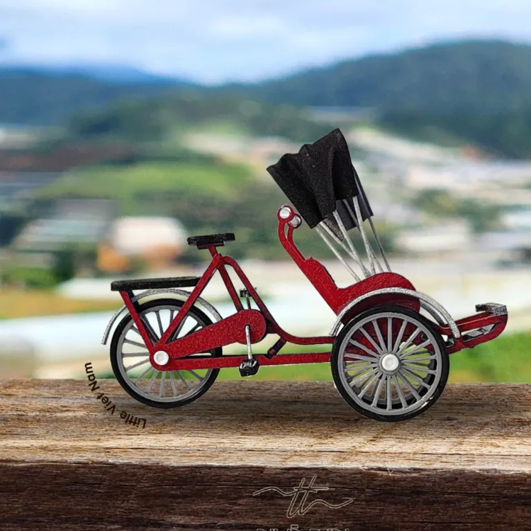 The Vietnamese Cyclo Magnet from the Little Vietnam Collection is a beautifully handcrafted souvenir, perfect for adding a touch of Vietnamese culture to your space—a unique Vietnamese-inspired refrigerator magnet that makes a memorable keepsake or gift