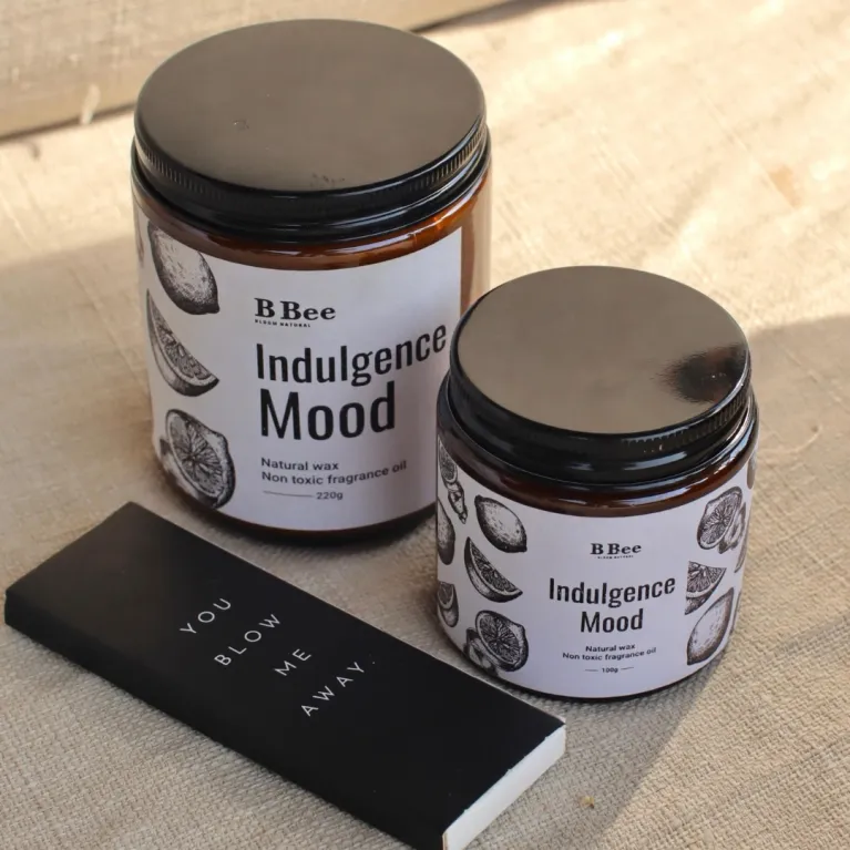 The "Indulgence Mood" Scented Candle with Sticker, made from premium ingredients, immerses you in sweetness and allure, making it an exquisite birthday gift that offers a natural, soothing fragrance.