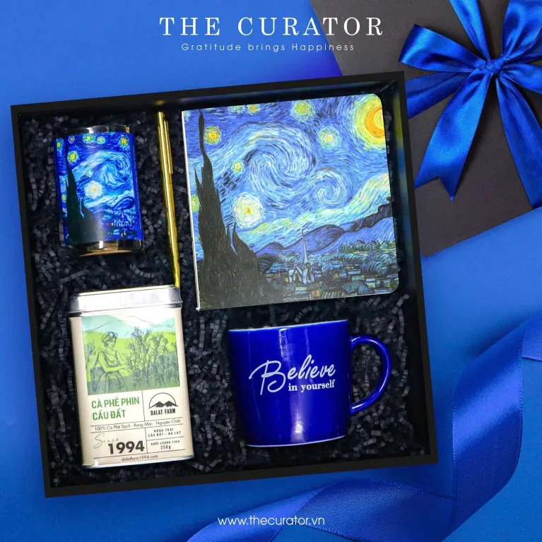 "Believe In Spirit gift box impresses through Van Gogh's timeless artistry, featuring an elegant ceramic mug paired with a refined notebook alongside aromatic scented candle and premium coffee, creating a thoughtful birthday present or sophisticated corporate gift that inspires creativity.