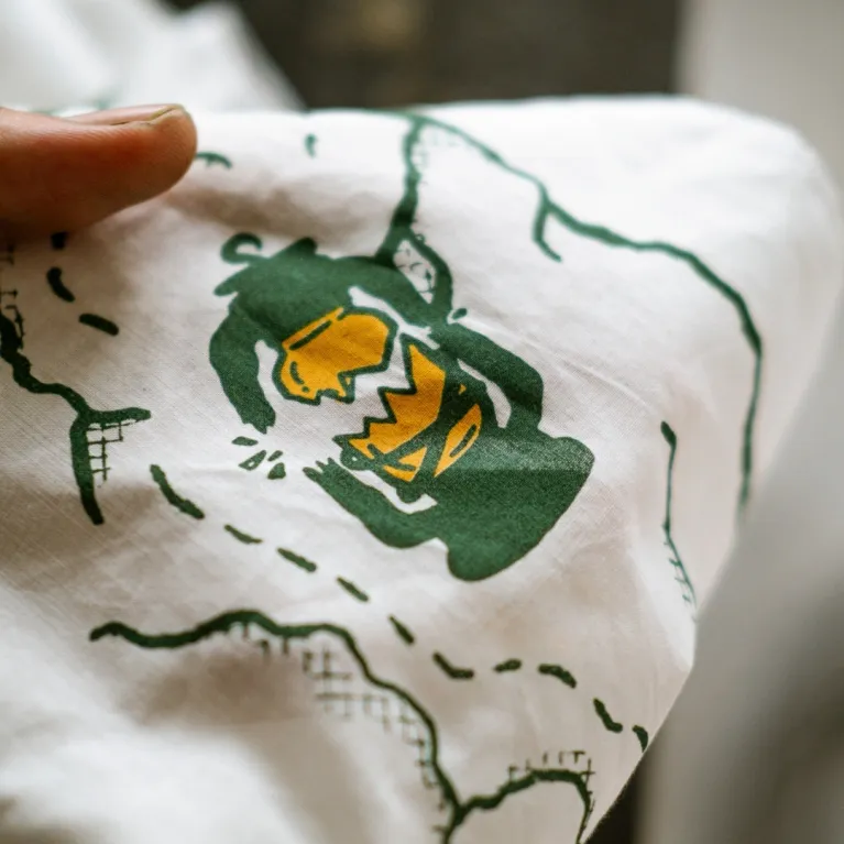 Here Today - Gone Tomorrow scarf serves as a statement piece for travel enthusiasts, featuring artistic designs printed on exclusive cotton fabric, doubling as both a practical travel accessory and authentic Vietnamese souvenir.