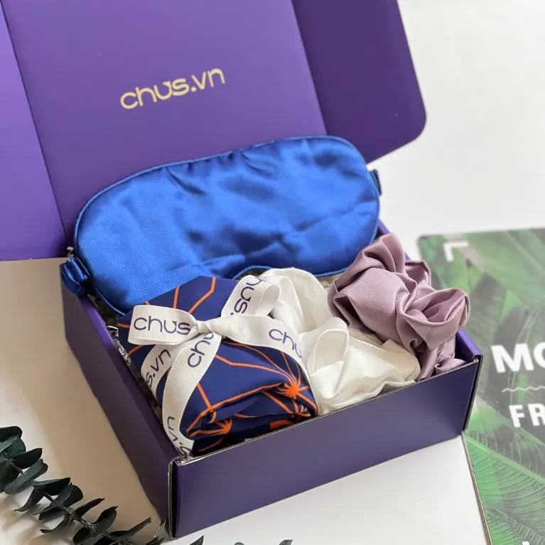Feminine silk gift box featuring exclusive Vietnamese silk eye mask, hair tie and scarf set, creating gentle moments as perfect birthday gift for her