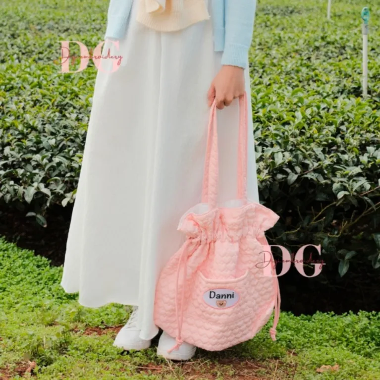 Personalized embroidered quilted bag enchanted by rare adorable beauty, featuring a cute drawstring pouch design as a unique accessory for personalized birthday gifts.
