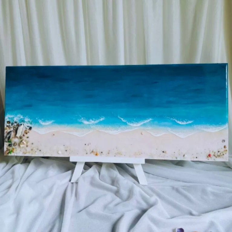 3D epoxy resin beach painting captures vibrant ocean beauty through lifelike dimensional effects, showcasing exquisite handcraftsmanship as distinctive home decor, impressive artistic gift and unique housewarming present.