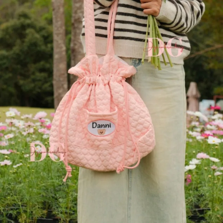 Personalized embroidered quilted bag enchanted by rare adorable beauty, featuring a cute drawstring pouch design as a unique accessory for personalized birthday gifts.
