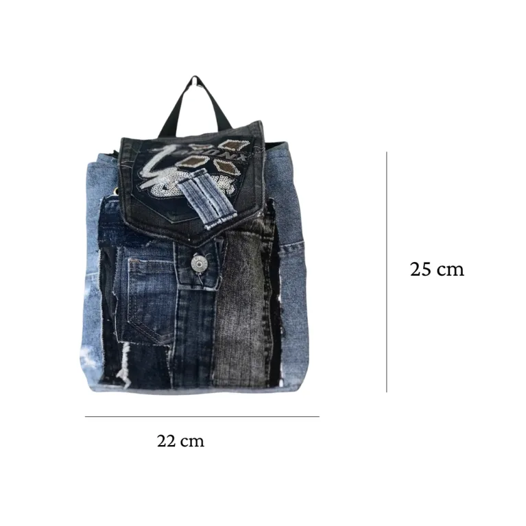 Sparkling mini backpack repurposed from old jeans creates signature piece for sustainable fashion enthusiasts, featuring unique drawstring design as distinctive fashion accessory and creative birthday gift.