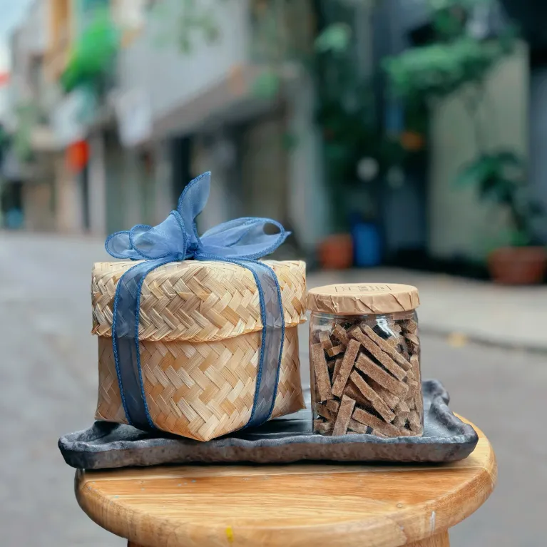 Sliced ginger candy bamboo gift box 350gr with natural refined flavor, featuring cold relief ginger as healthy candy making a perfect gift for family and Vietnamese specialty gift