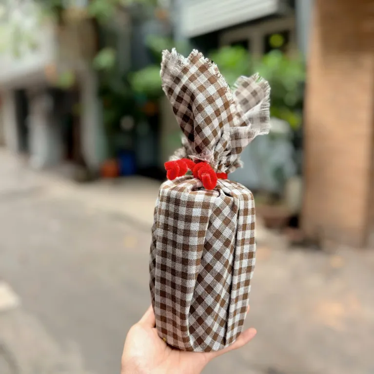 HeyDay pure cacao powder gift 200g packaged with original authentic flavor in a premium jar wrapped with Vietnamese plaid scarf, making a distinctive Vietnamese specialty gift.
