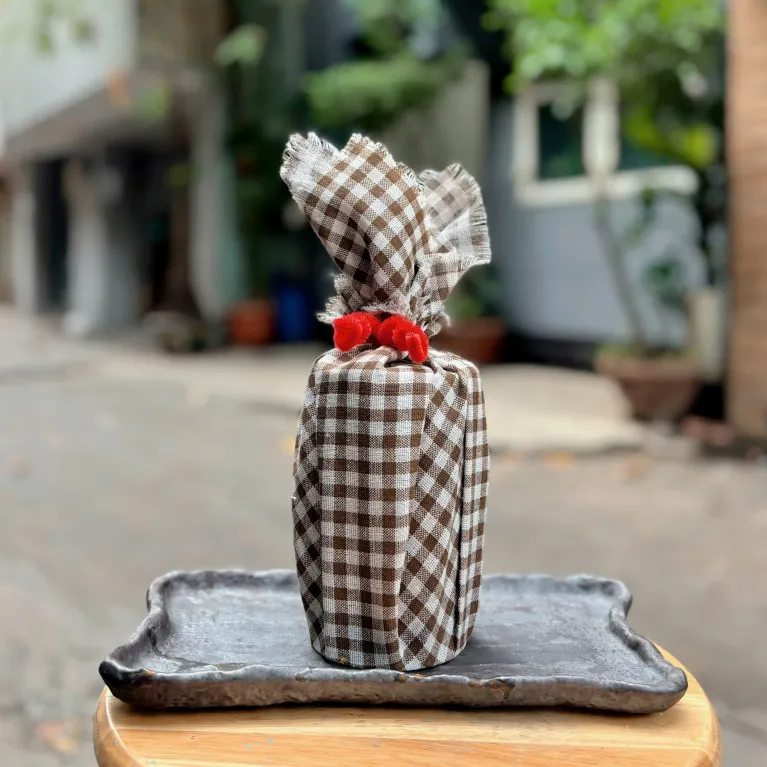 HeyDay pure cacao powder gift 200g packaged with original authentic flavor in a premium jar wrapped with Vietnamese plaid scarf, making a distinctive Vietnamese specialty gift.