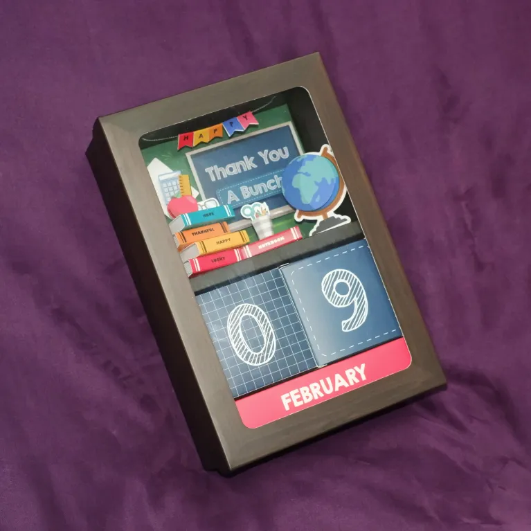 "Enlightenment" personalized gift box creates creative tribute to honor educators with desk calendar featuring 3D pages and premium sweets confectionery gift set as meaningful gift for teachers.