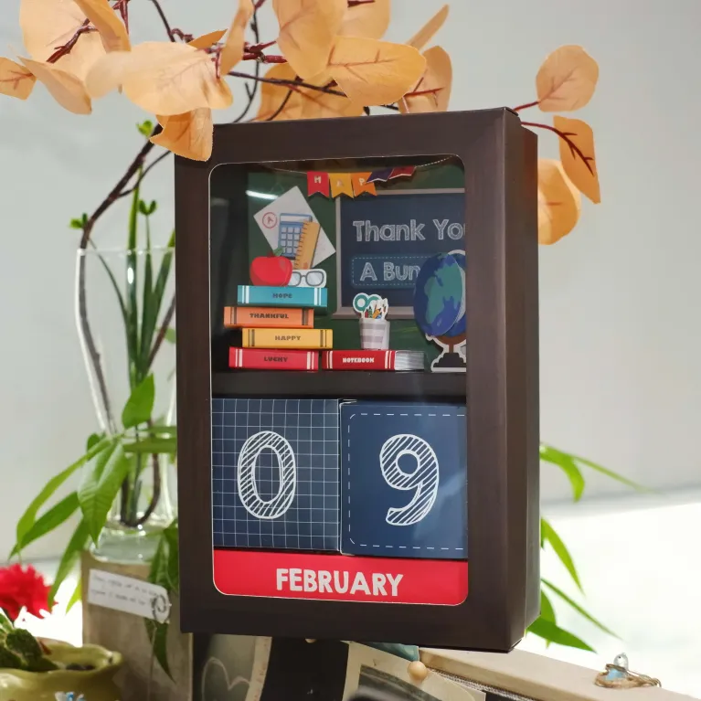 "Enlightenment" personalized gift box creates creative tribute to honor educators with desk calendar featuring 3D pages and premium sweets confectionery gift set as meaningful gift for teachers.