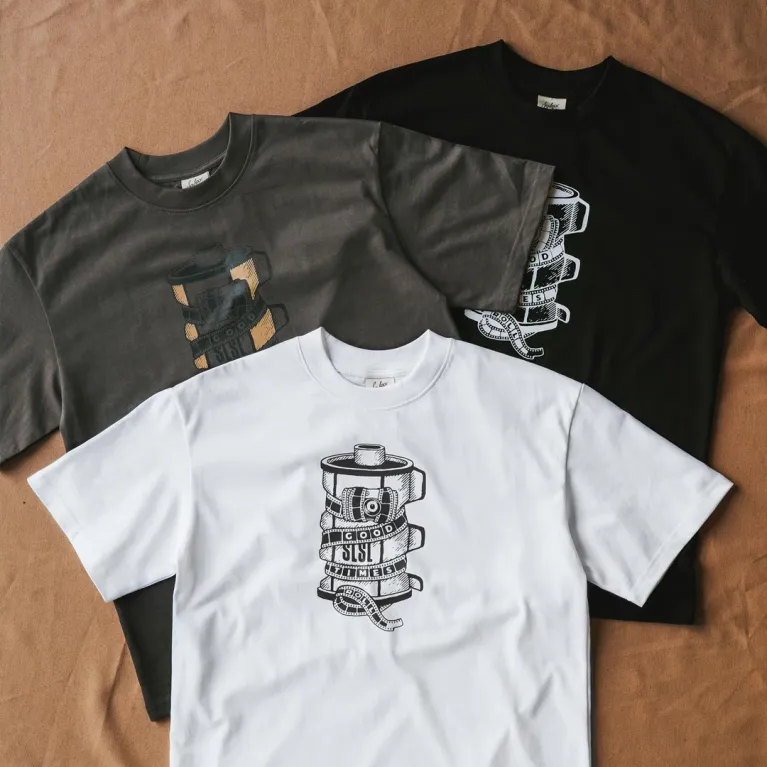 The "Good Times Roll" black cotton T-shirt captures every moment with a creative design, perfect for photography, travel, birthdays, or as a Vietnamese souvenir.