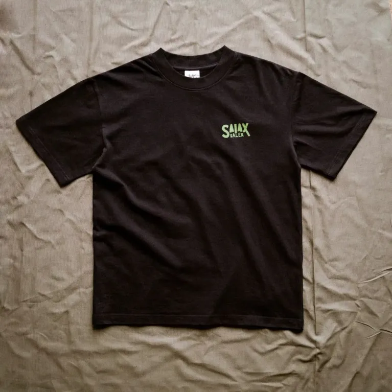 The "Here To Hear" cotton T-shirt connects nature and time with a creative design and comfortable fabric, perfect for travel, adventures, or as a birthday gift.