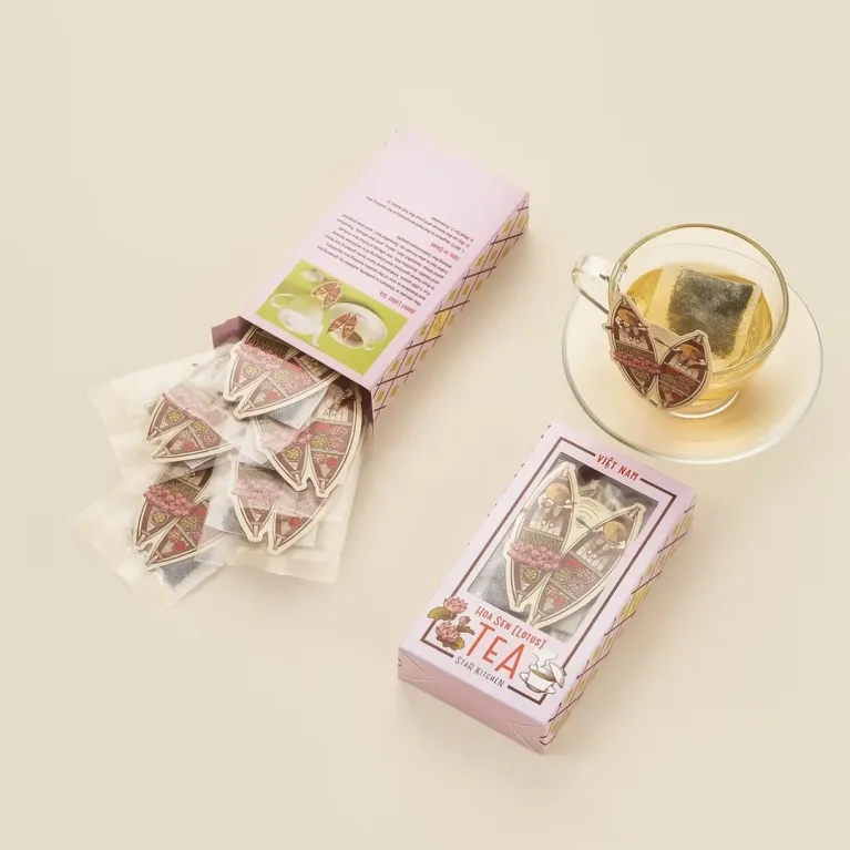 Vietnam Flower Tea combines green tea with blooming flowers in a beautifully packaged set, making it a unique souvenir and convenient specialty gift from Vietnam.