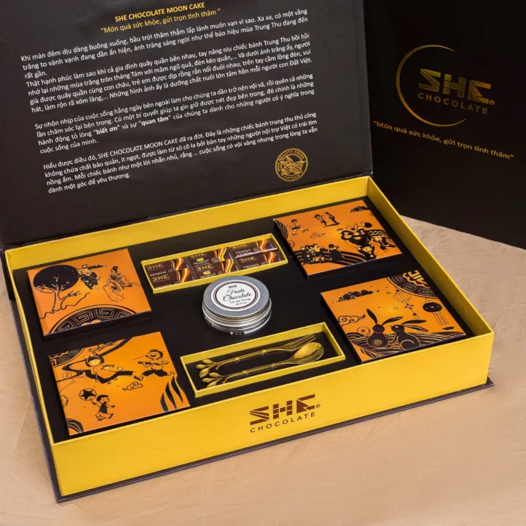 “Brown Moonlight” gift box with 4 chocolate mooncakes, assorted chocolates, nuts & cutlery set – premium Mid-Autumn corporate gift.