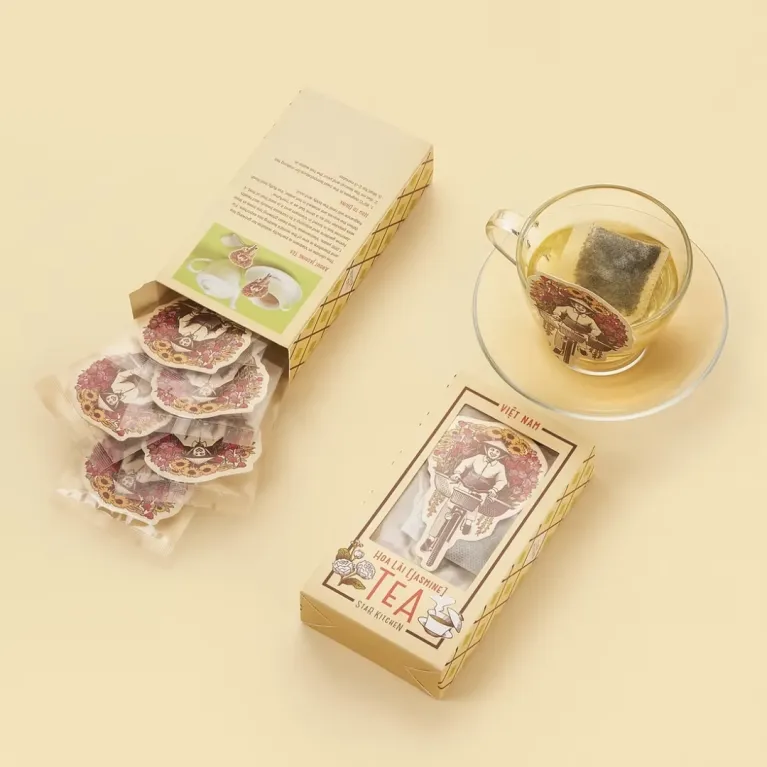Vietnam Flower Tea combines green tea with blooming flowers in a beautifully packaged set, making it a unique souvenir and convenient specialty gift from Vietnam.