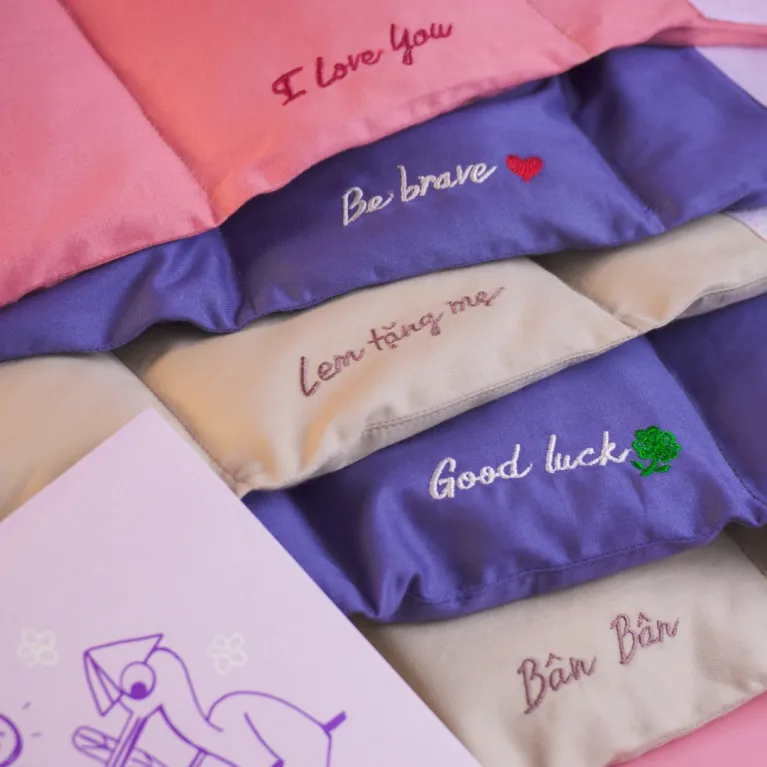 The “For Her” personalized gift box honors her elegance with a hidden-message scented candle, a name-embroidered wrist pillow, and an exclusive postcard for a truly sophisticated present.