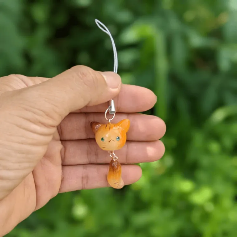 A cute polymer clay keychain featuring plants and animals, handmade with care and perfect as a unique Vietnam souvenir gift.