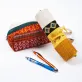 brocade pen bag, traditional terracotta pattern, unique cylinder design, durable material, handcrafted product, unique accessory