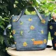 túi tote thêu hoa dã quỳ từ jeans tái chế, màu xanh sáng trẻ trung hiện đại, họa tiết màu vàng rực rỡ, tái chế, upcycle, eco, sống xanh, renew jeans, chus